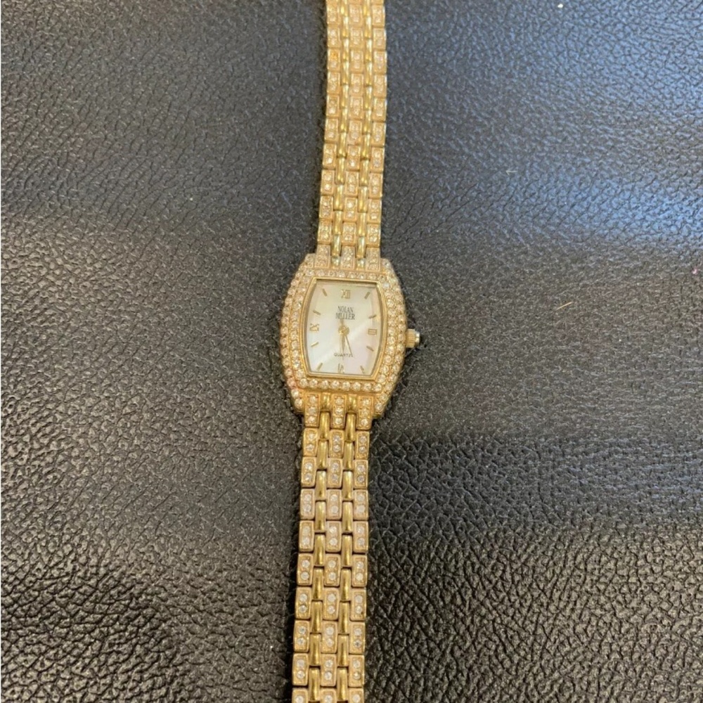 Ladies vintage watch by Nolan Miller. Gold tone with sparkly stones.